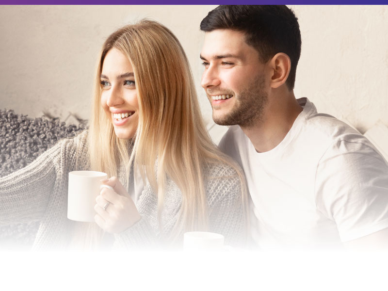 image of couple drinking coffee and watching tv